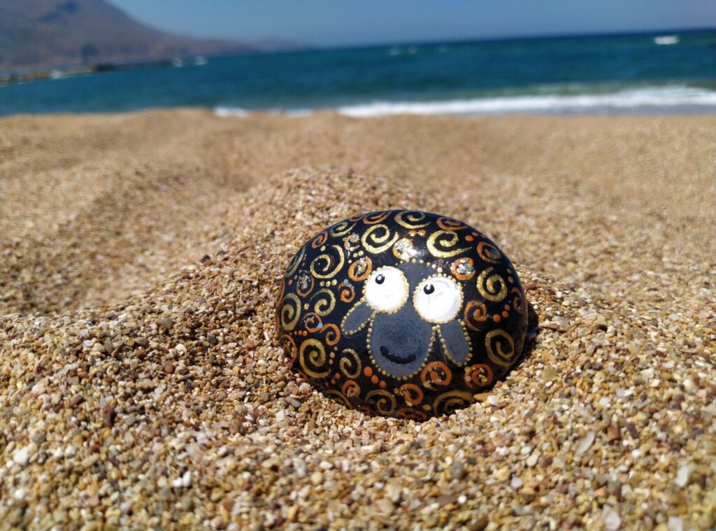 Cheerful little sheep handpainted on sea stone