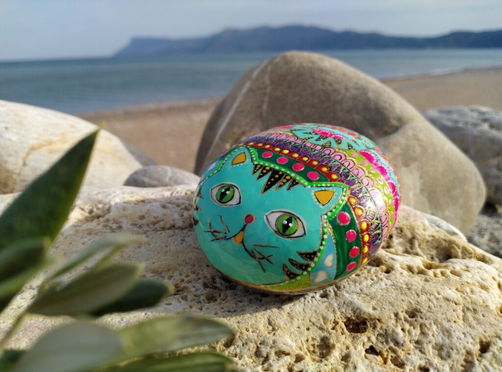 Colorful kitty painted on sea stone in Falassarna