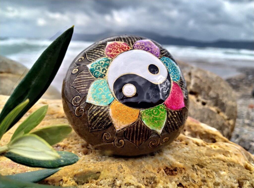 Yan yang flower painted on sea stone in Kissamos