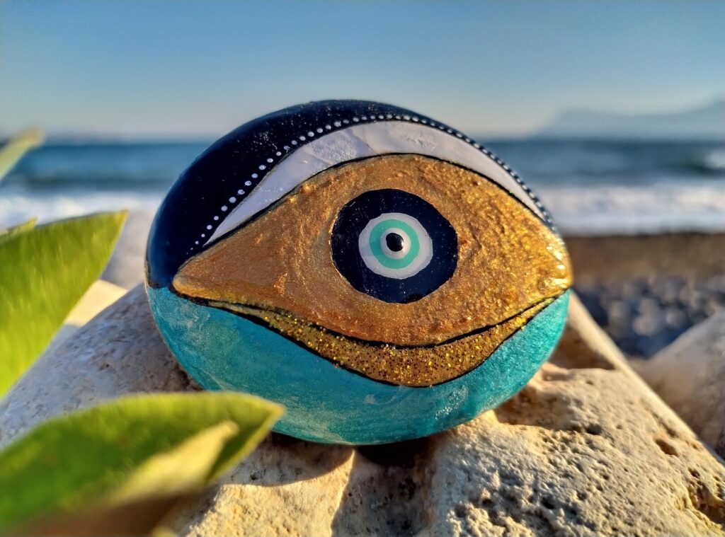 Evil eye painted on rock