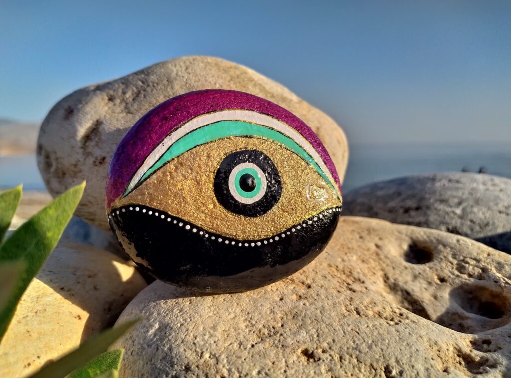 Evil eye painted on stone