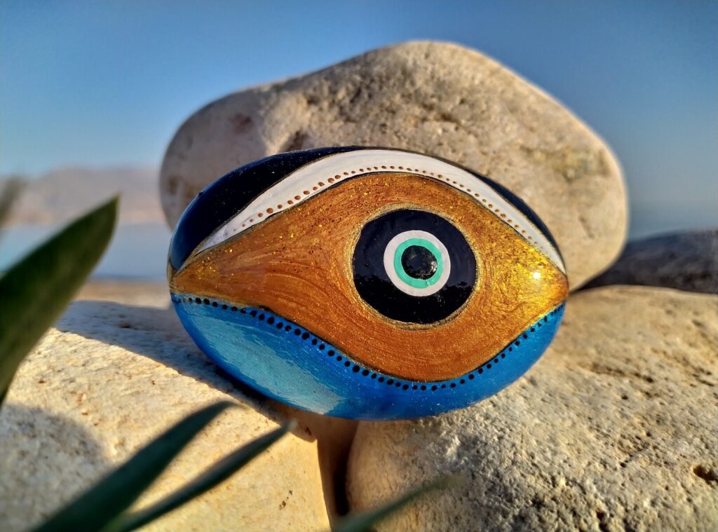 Evil eye painted on stone