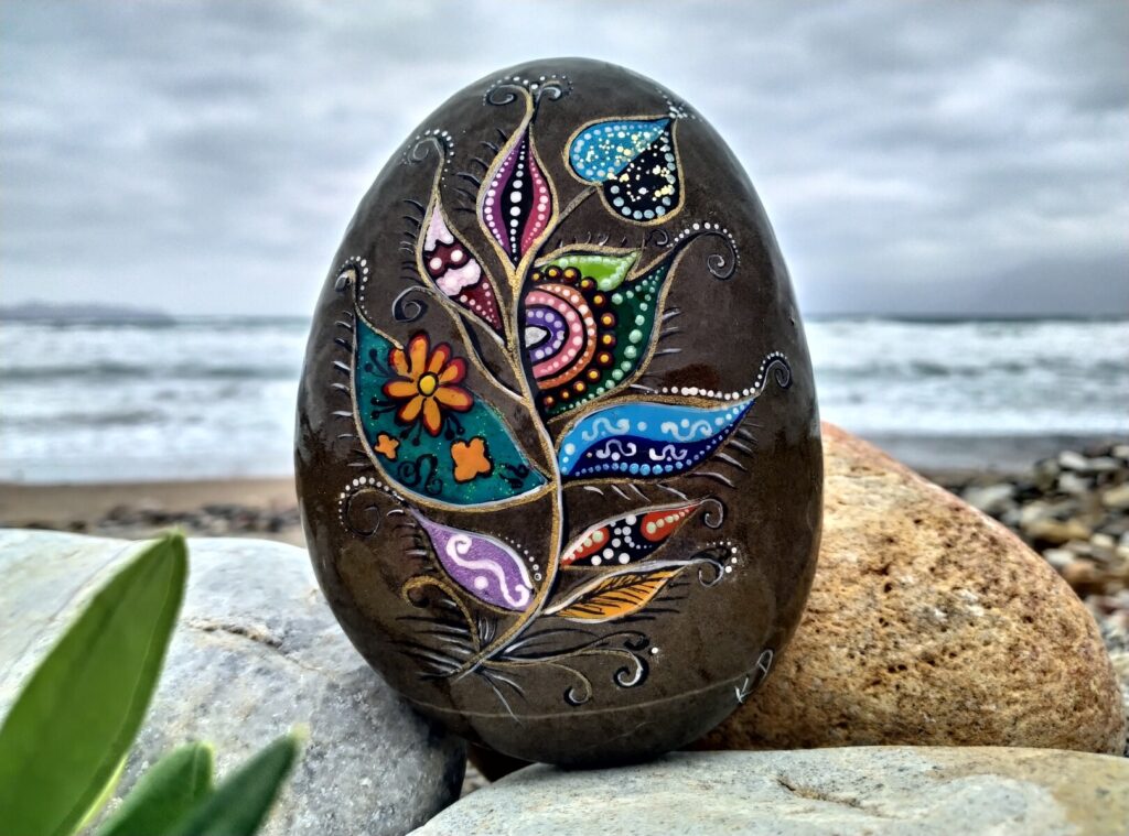 Colorful leaf painted on stone from balos beach