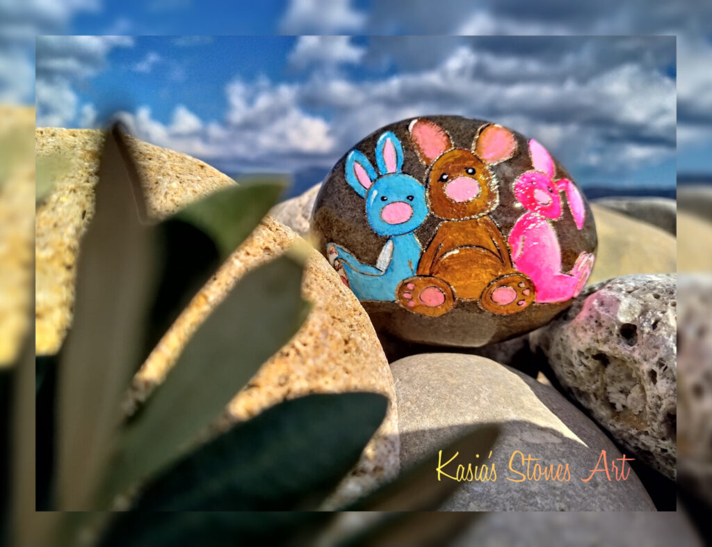 Easter bunnies painted on stone